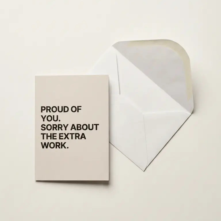 Greeting card with text 'Proud of you. Sorry about the extra work.' on a beige background