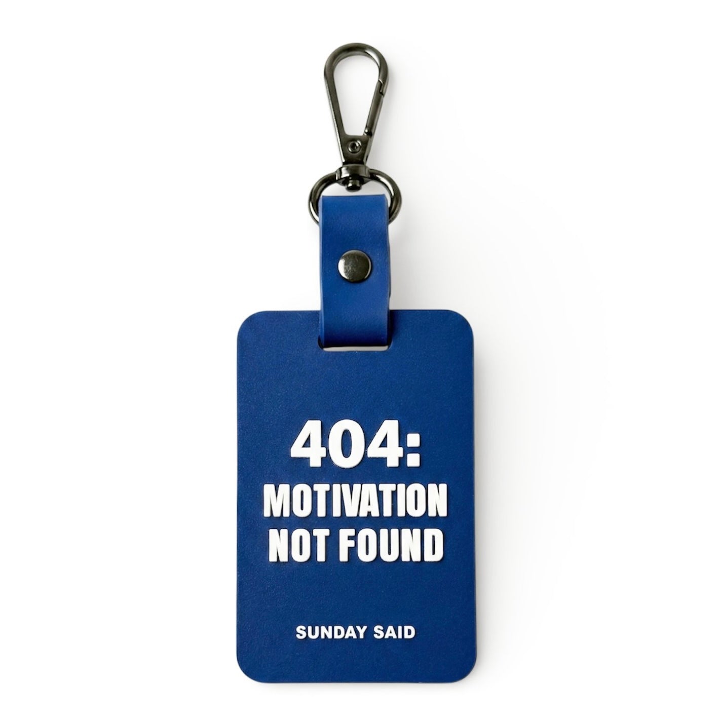 Blue 404 Error bag charm with funny Motivation Not Found text. Relatable corporate humor gift for coworkers and tech workers by Sunday Said.