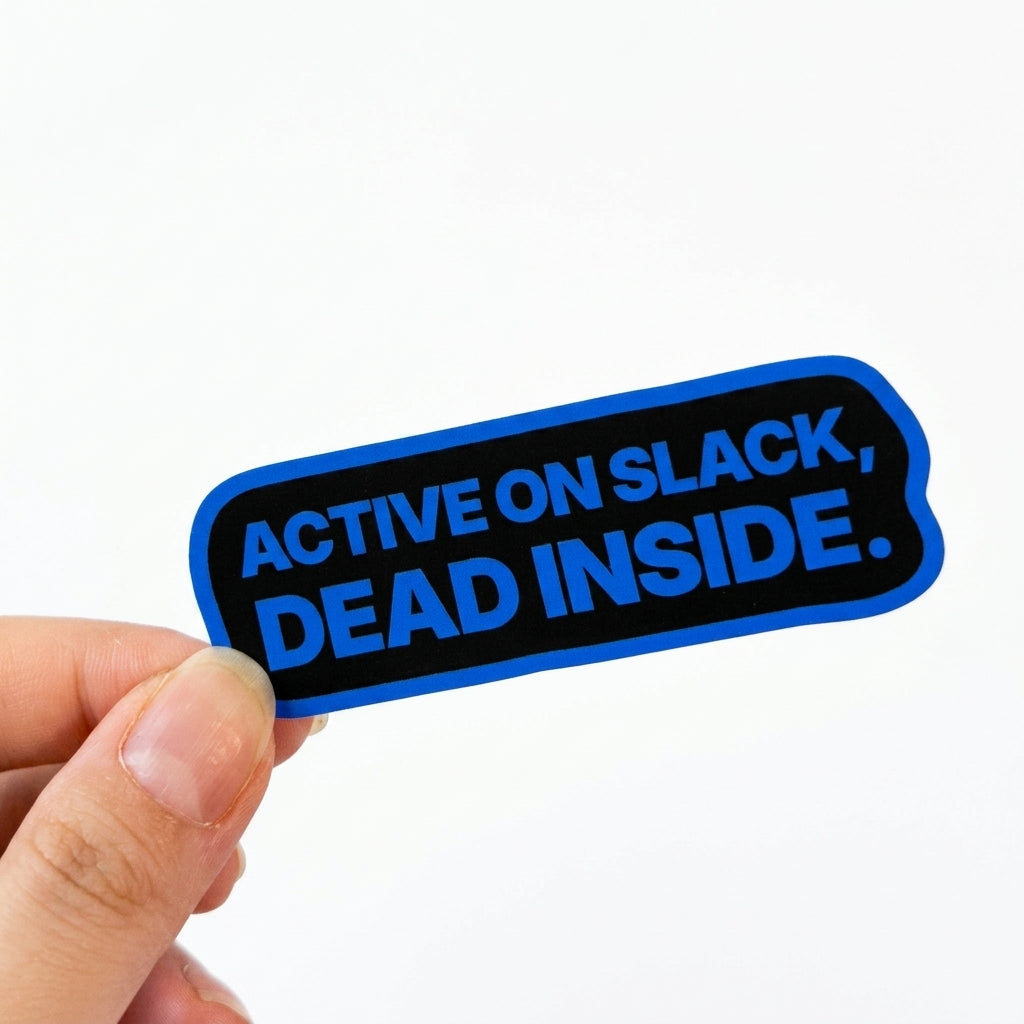 Black workplace humor sticker with blue text reading “Active on Slack, dead inside.”