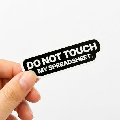 Black workplace sticker with white text reading “Do not touch my spreadsheet.”