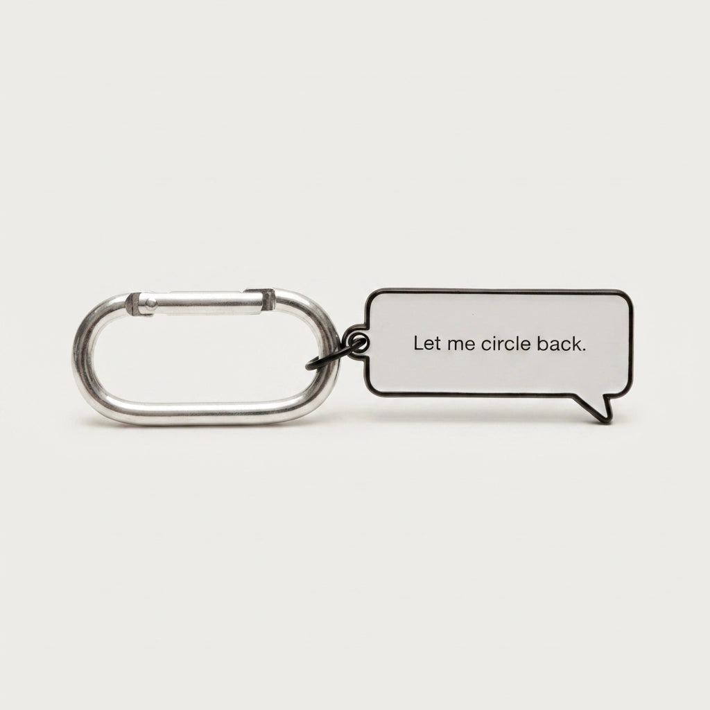 Keychain with a speech bubble tag reading 'Let me circle back.' on a white background