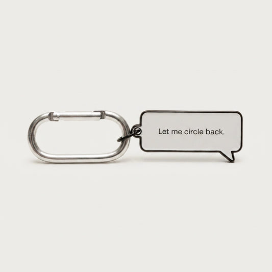 Keychain with a speech bubble tag reading 'Let me circle back.' on a white background