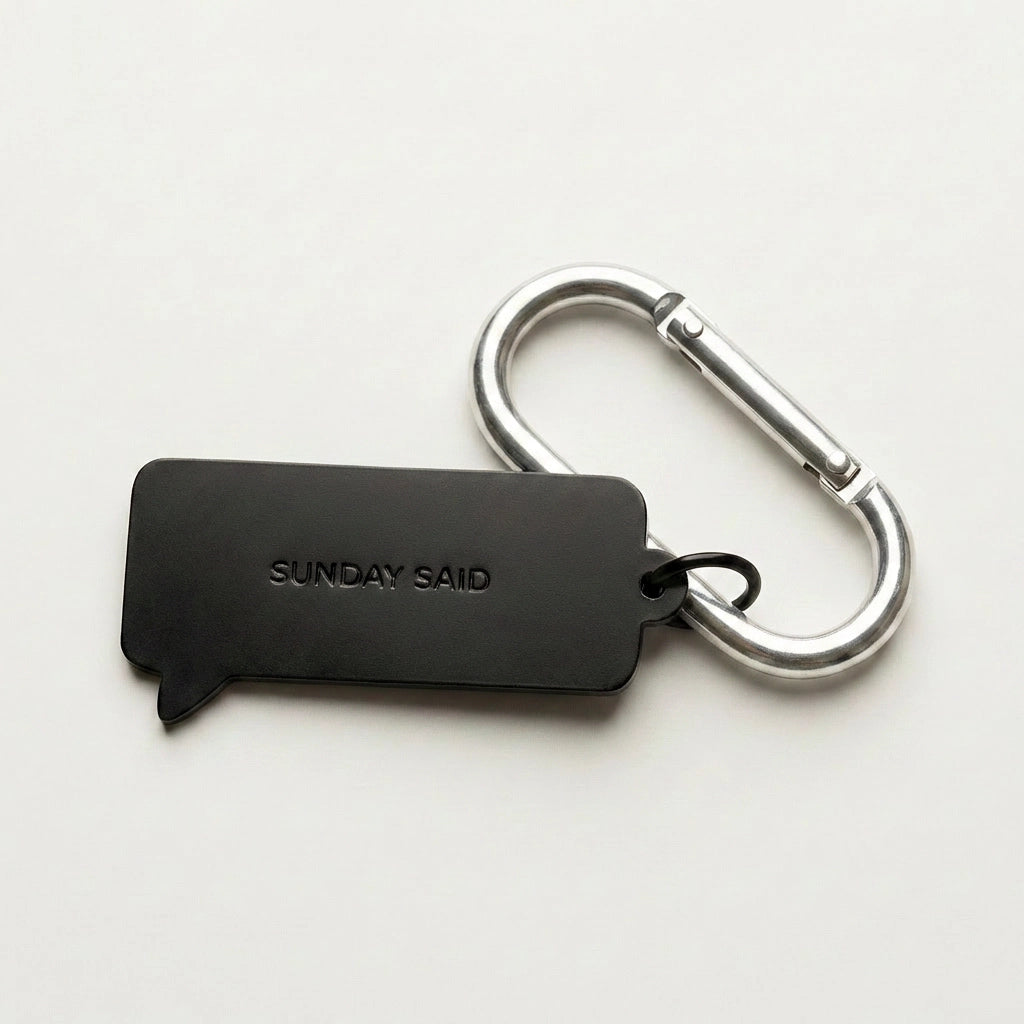 Black keychain with carabiner on a white background