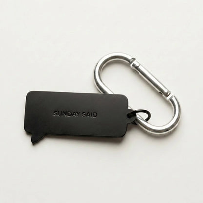 Black keychain with carabiner on a white background