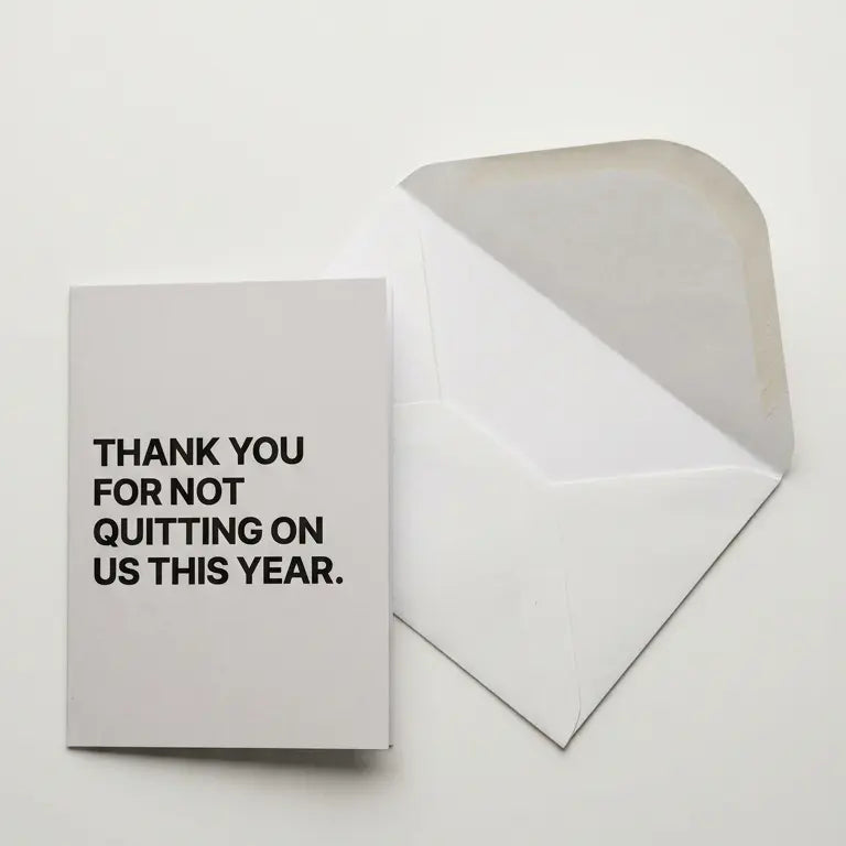 Greeting card with 'Thank you for not quitting on us this year' text on a white background